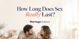How Long Does Sex Last (2026): Stopwatch Studies Put the Median at 5.4 Minutes Smiling couple in T-shirts lying on a bright white bed facing each other, under the headline How Long Does Sex Really Last