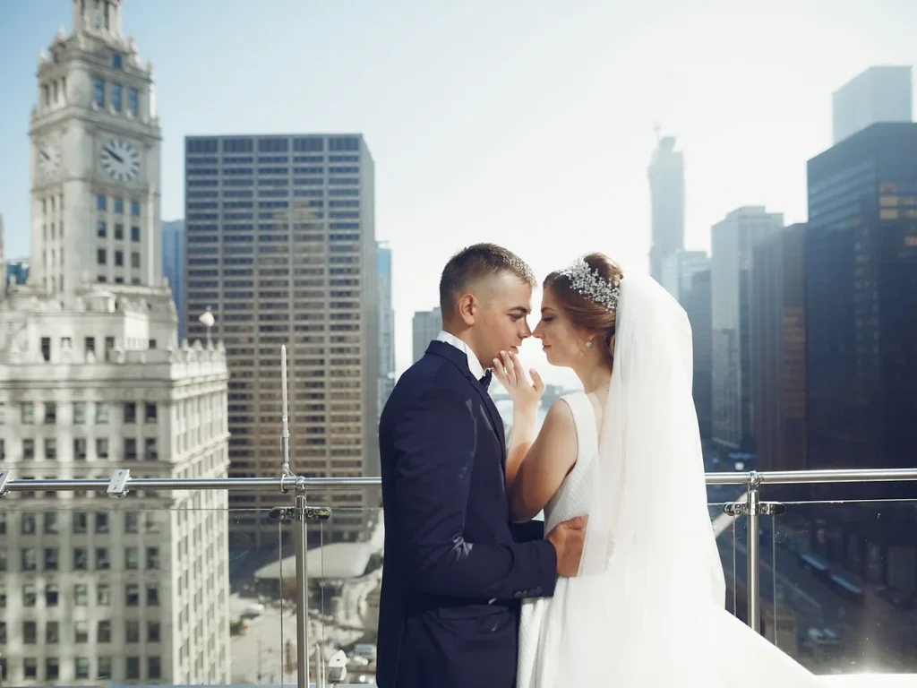 Bride and groom kissing among downtown high-rise buildings