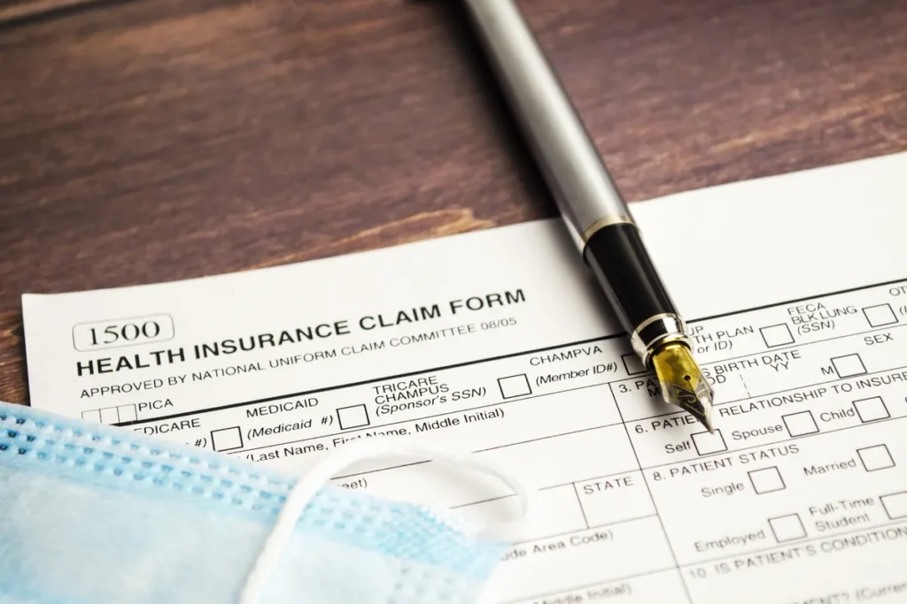 Health insurance claim form with a pen on a desk